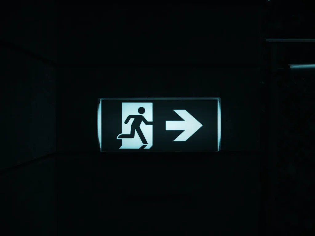 Illuminated emergency exit sign